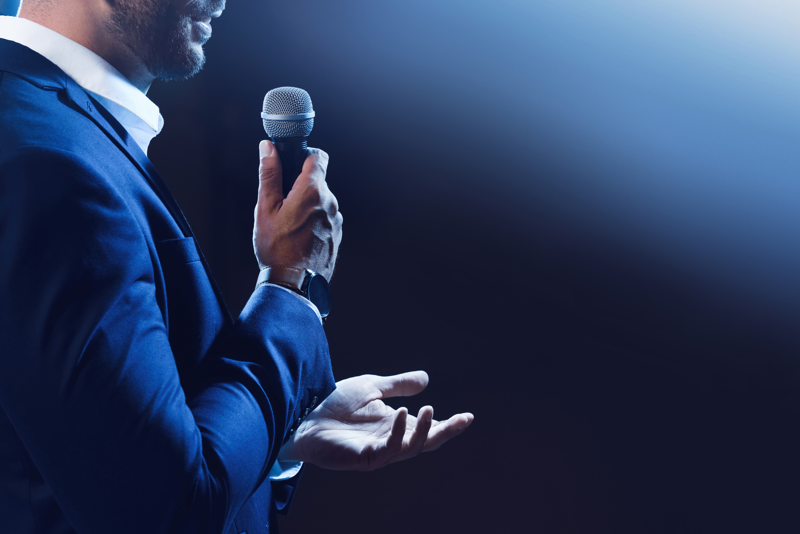 Motivational Speaker with Microphone Performing on Stage, Closeu